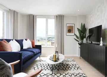 Stylish open-plan living space flooded with natural light leading in from the terrace and large windows.