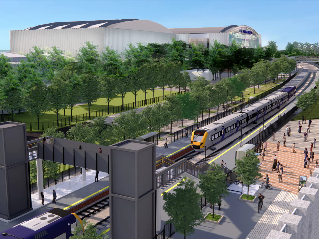 The scene depicts a brand new train station, lined with trees, situated in Brabazon.