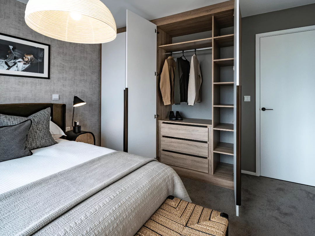 Master bedroom showcasing a built-in wardrobe, adding functionality and style to the space.