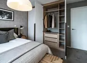 Master bedroom showcasing a built-in wardrobe, adding functionality and style to the space.