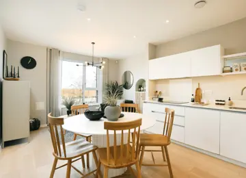 Stylish open-plan kitchen diner, featuring open shelving and a convenient seating area.