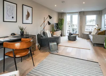 Open-plan living room flooded with natural light leading in from the terrace.