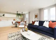 Open-plan living space flooded with natural light leading in from the terrace and large windows.