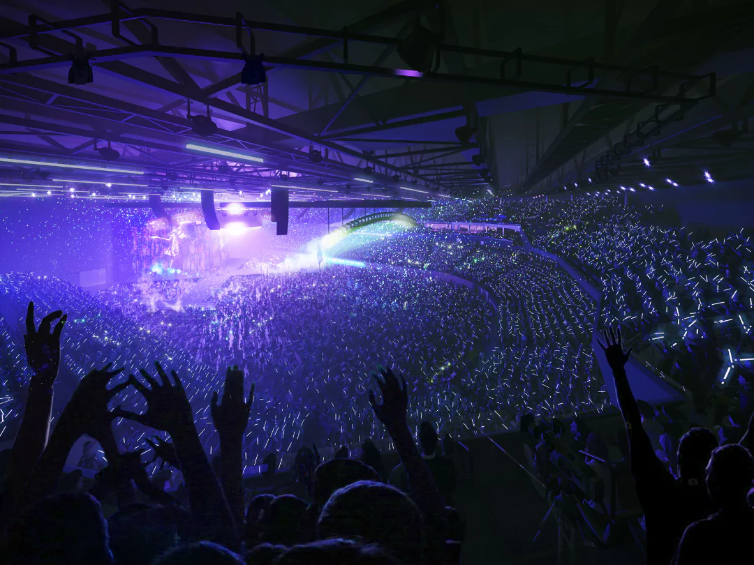 Energetic concert atmosphere inside YTL Arena Bristol amid vibrant stage lights.