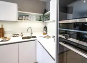 Styled kitchen corner, featuring white work tops and siemens appliances.