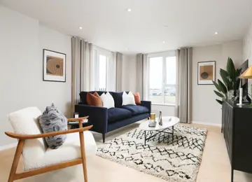 Open-plan living room flooded with natural light leading in from the terrace.