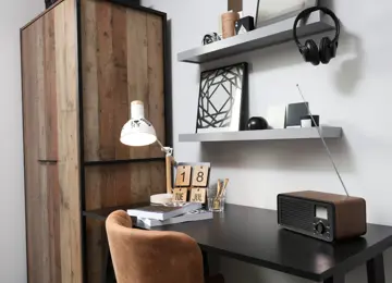 Wooden desk within the teen double bedroom, to be used as a home study.