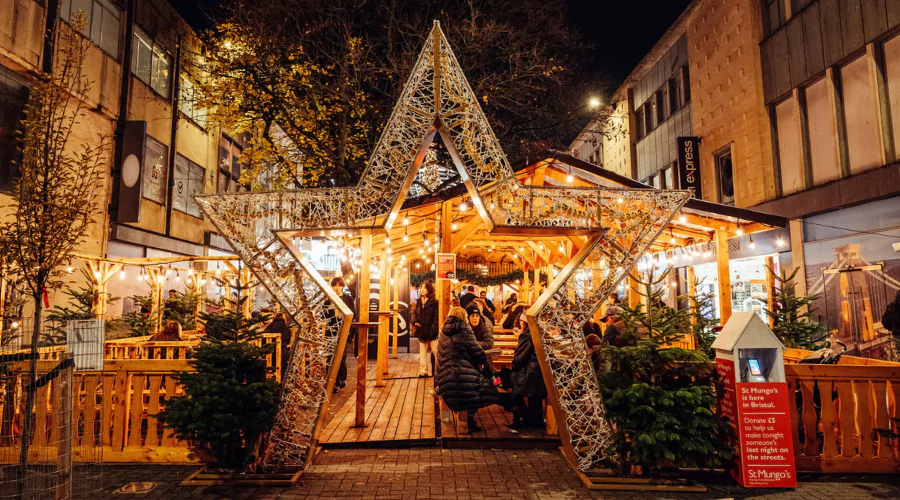 Aa night time image at Bristol Christmas Market Broadmead featuring a large lit up star.