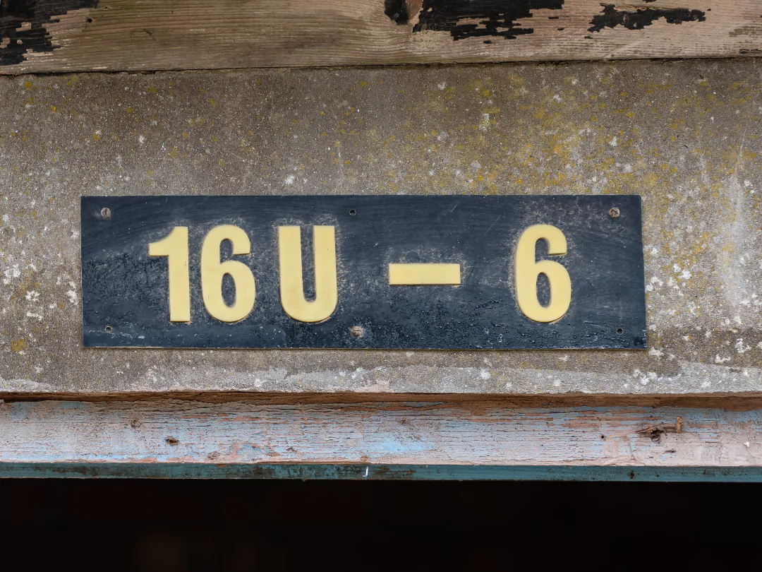 Close up of the aged Hangar 16U sign.