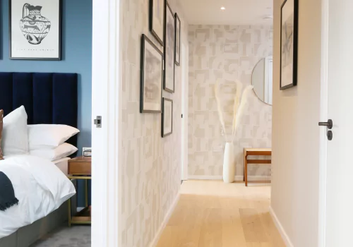 The Show Apartment at Brabazon Hallway and bedroom in a modern apartment with light wood flooring.